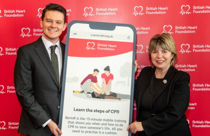 Maria Caulfield, MP for Lewes, joins The British Heart Foundation in Parliament to learn CPR with RevivR