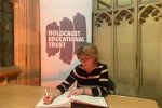 Maria Caulfield, MP for Lewes, signs Holocaust Educational Trust Book of Commitment 