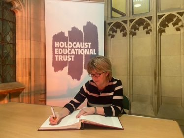 Maria Caulfield, MP for Lewes, signs Holocaust Educational Trust Book of Commitment 